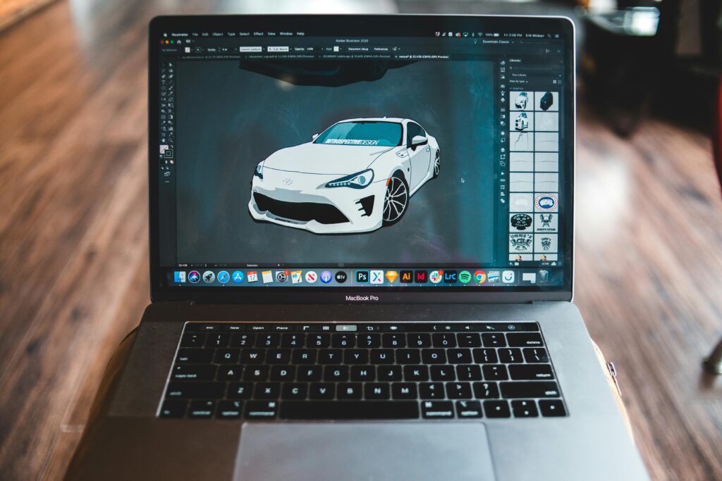 alt="Graphic design software for beginners on laptop screen"Picture of sports car in graphic editor application on screen of modern laptop