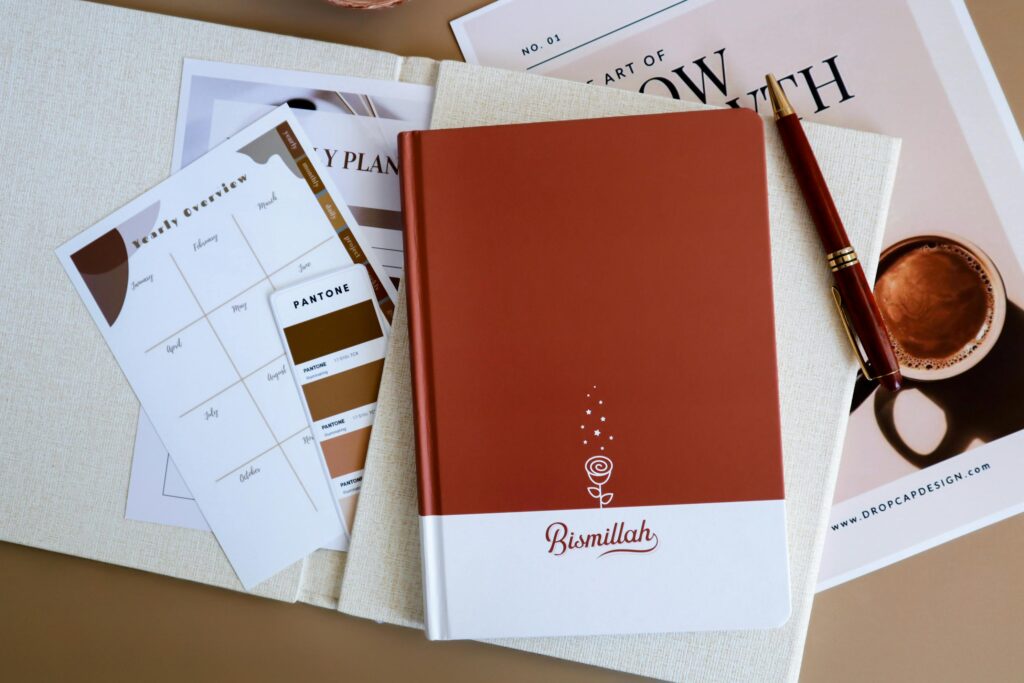 Canva digital planner for beginners Flat lay of modern notebooks, planners, and stationery for organized lifestyle.