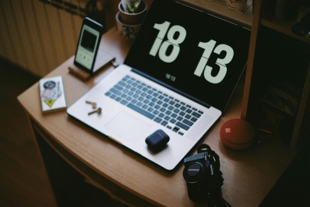 pexels photo 9986410 9986410 A cozy home workspace with a laptop, smartphone, camera, and headphones. Ideal for tech enthusiasts.